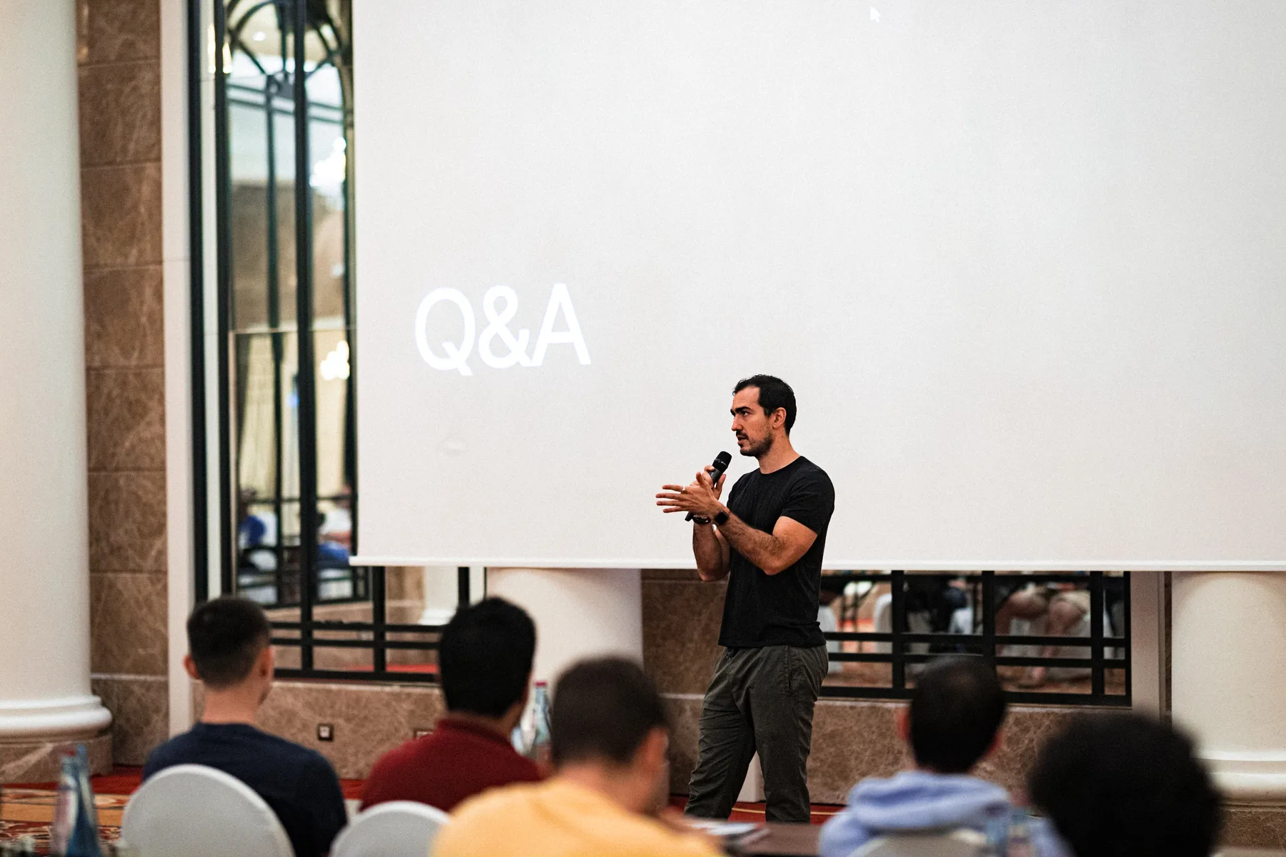 Audience during a Q&A session at a business conference