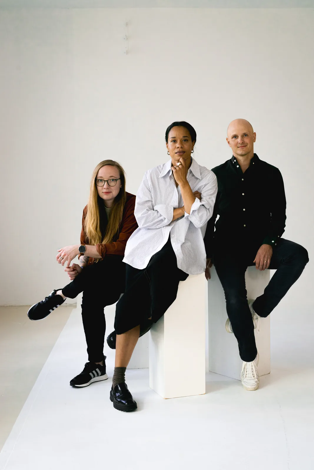 Editorial studio portrait of a small leadership team in Barcelona